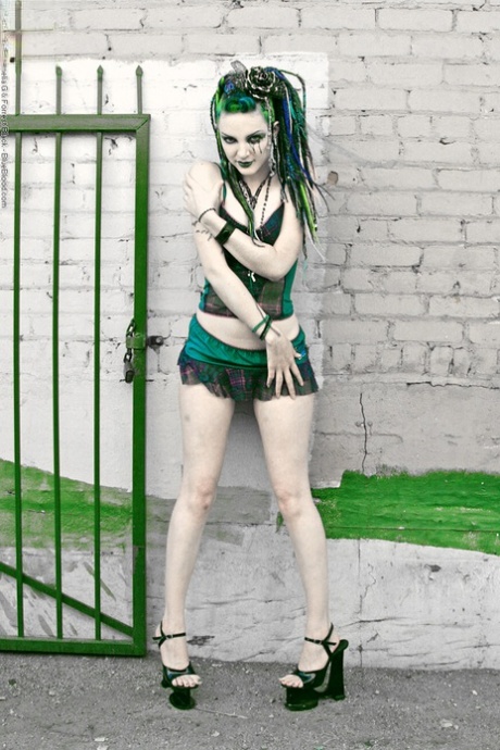Alt girl Scar 13 places hands over her boobs while against a brick wall 10642204