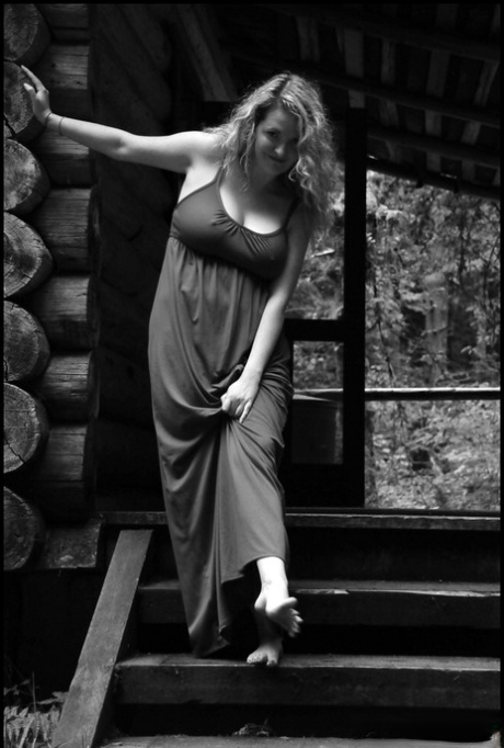 Mature blonde Tasty Trixie exposes her big naturals outside a log cabin 61744842