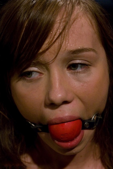 Pretty girl is blindfolded and ball gagged during sex play in a dungeon 68402670