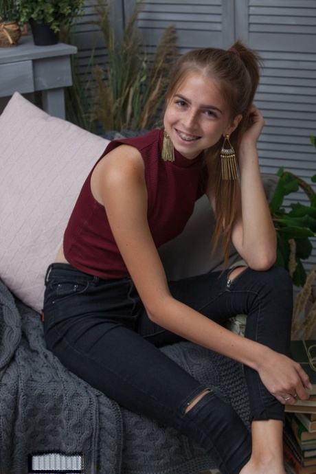 Skinny teen Rina casually displays her shaved pussy after disrobing on a chair 97436406