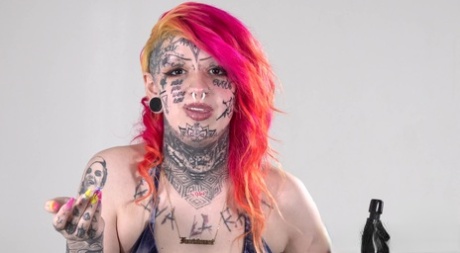 Solo girl with dyed hair Mami displays her heavily tattooed body in a bikini 96693833