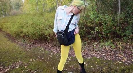 Blonde girl Squanch Baby pisses upon a mirror on a moss covered path 83939203