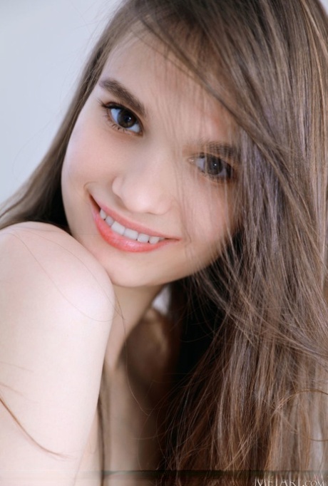 Sweet teen Anastasia Bella gets naked on a table in white ankle socks 41227309