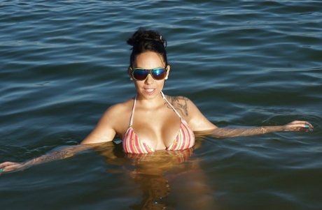 Tanned brunette Marta Sanz demonstrates her big boobies in the ocean 53039686